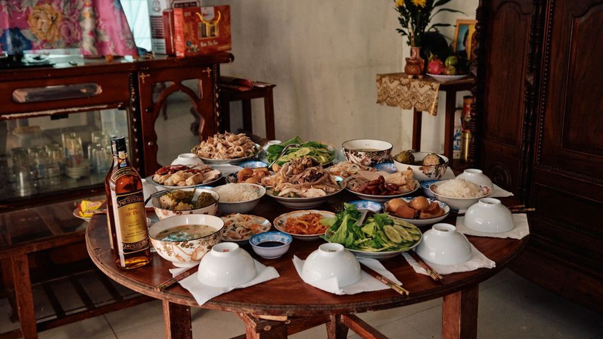 round dining table family meal kids passing dishes